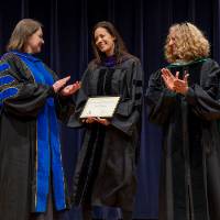 Christine and Provost Drake applauding awardee